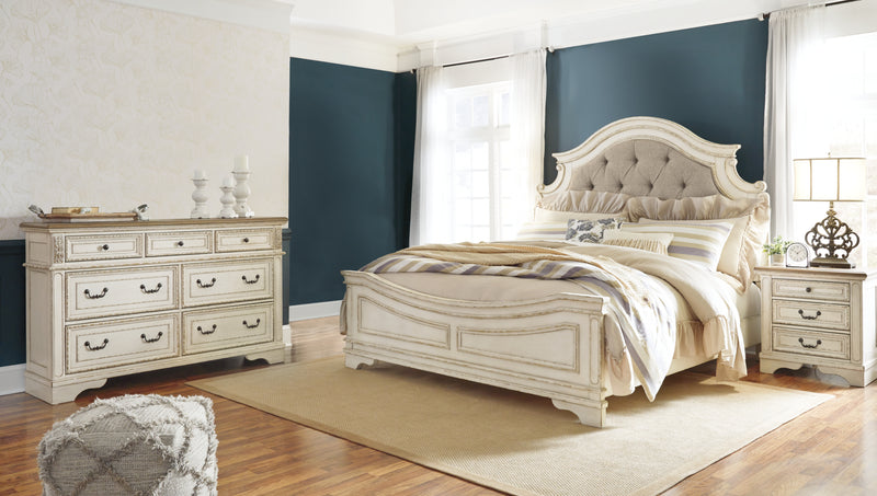 Realyn King Upholstered Panel Bed and Dresser